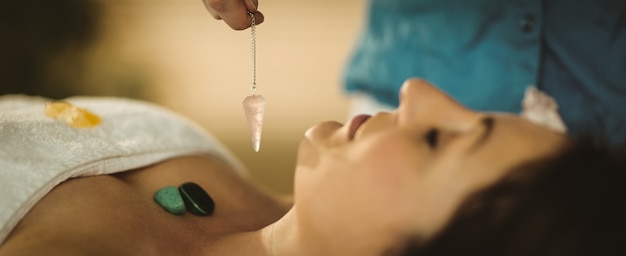 Young woman at crystal healing session