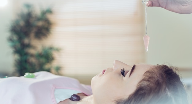 Young woman at crystal healing session