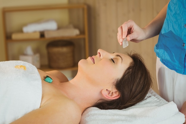 Young woman at crystal healing session