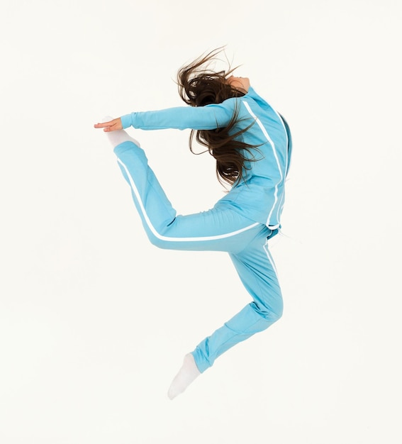 Young woman dancer dancing contemp on white background, copy space