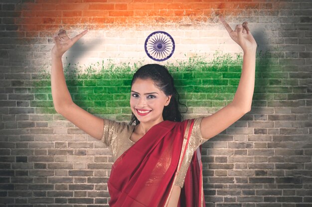 Young woman dancing with India flag background