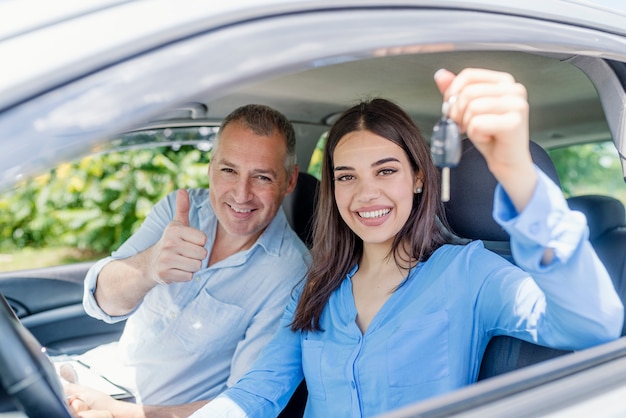 Young woman delighted having just passed her driving test