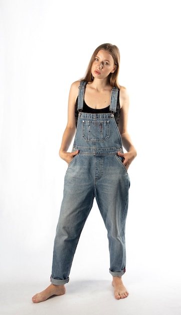 young woman in denim overalls,