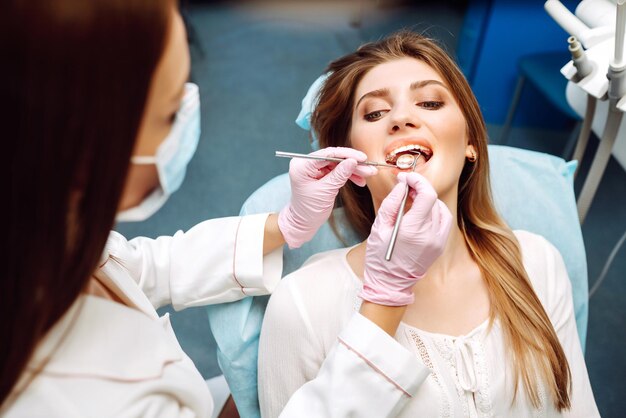 Photo young woman at the dentists chair during a dental procedure overview of dental caries prevention