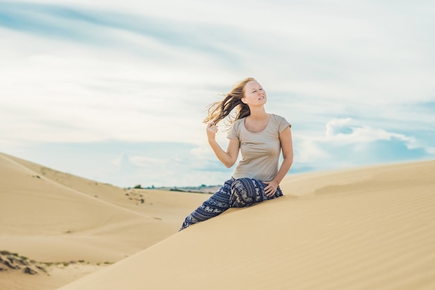 Young woman in the desert, Mui Ne, Vietnam