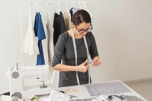  young woman designer process of creating a dress