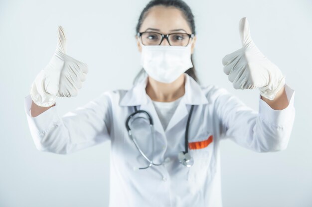 Young woman doctor  hand okay sign