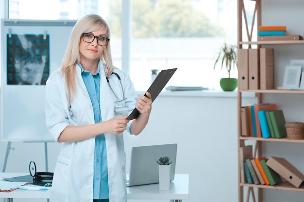 Young woman doctor occupation in the hospital office