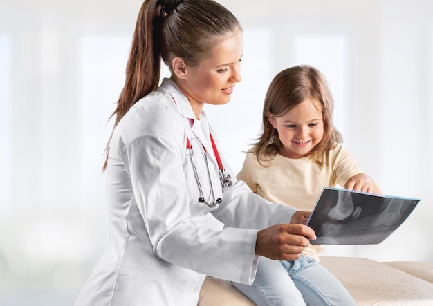 Young woman doctor with little girl