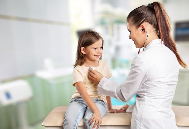 Young woman doctor with little girl