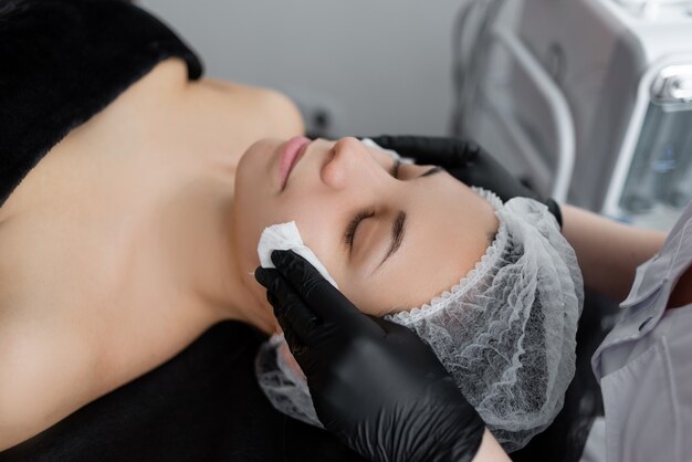 Young woman doing a cosmetic procedure