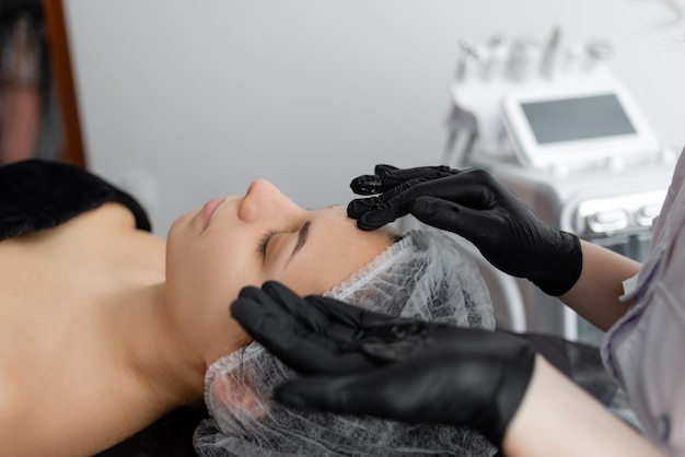 Young woman doing a cosmetic procedure