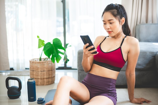 Young woman doing exercise at home, fitness sport for body building and training, health active happy girl lifestyle