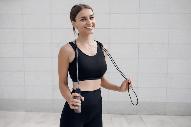 young woman doing fitness outdoor