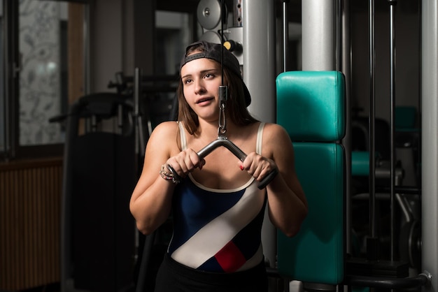 Young Woman Doing Heavy Weight Exercise For Triceps