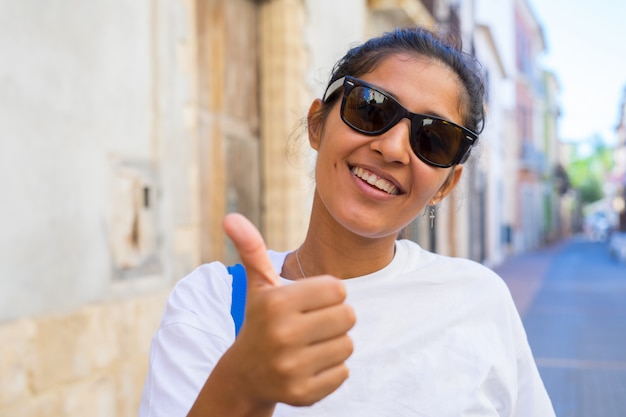 Young woman doing ok gesture