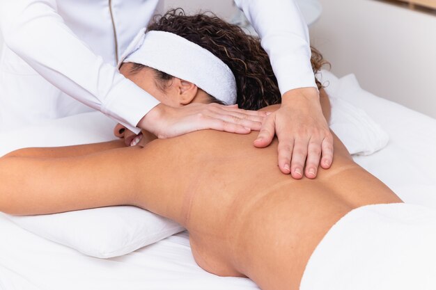 Young woman doing spa massage