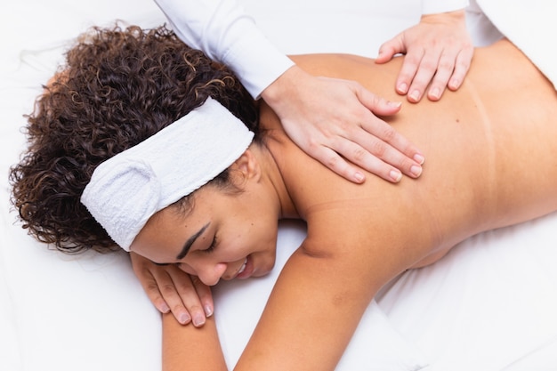 Young woman doing spa massage