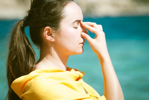 Young woman doing yoga breathing