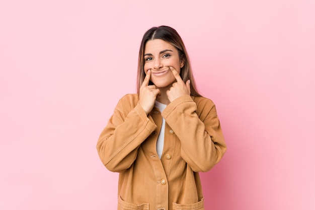 Young woman doubting between two options