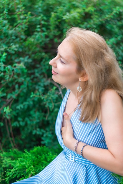 A young woman dreams in the park