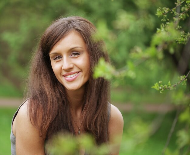 young woman in dress relaxing in  garden