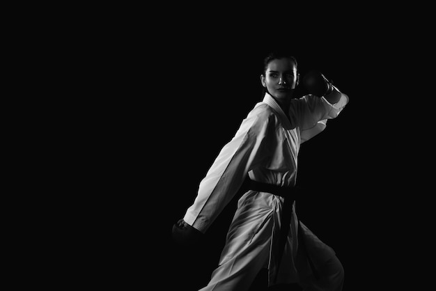 Young Woman Dressed In Traditional Kimono Black Background