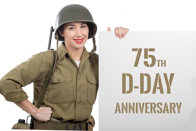 Young woman dressed in us  wwii military uniform with helmet 