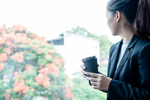 Young woman drinking coffee cup