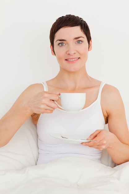 Young woman drinking tea