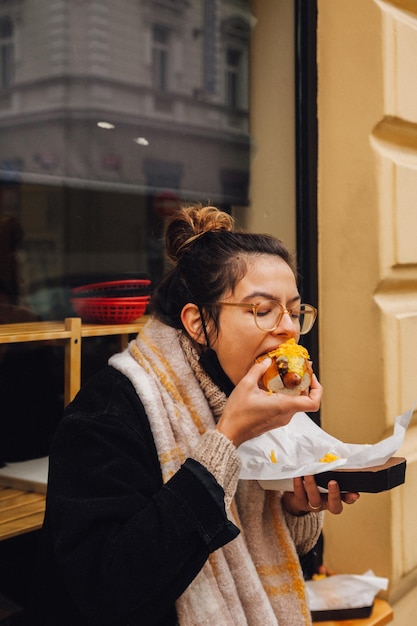 young woman eating food