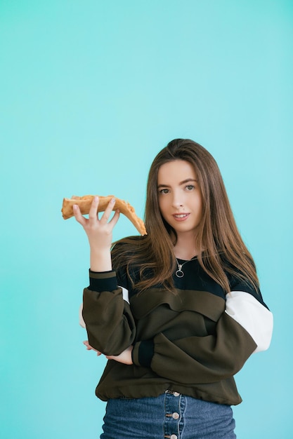 young woman eating pizza