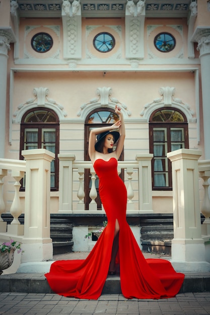 Young woman in an elegant dress posing