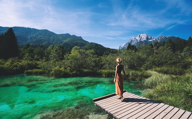 Young woman enjoying freedom on nature Travel Relaxation Lifestyle Image Nature background