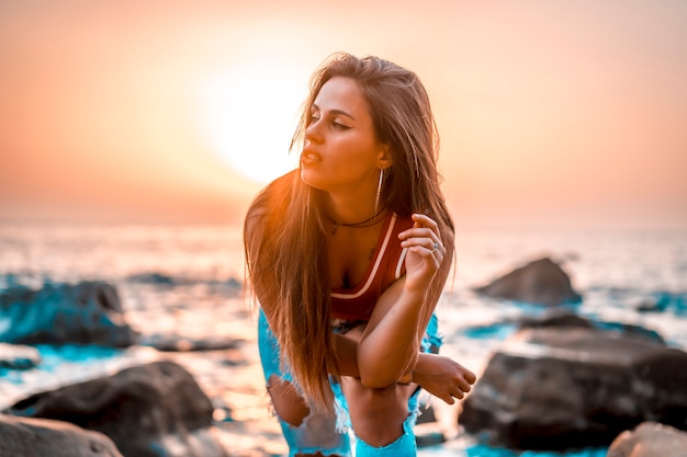 A young woman enjoying a sunset in the Basque Country