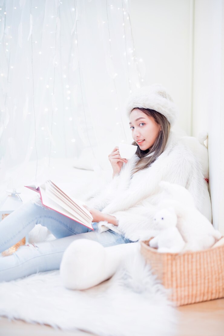 Young woman enjoying winter season. Relaxing and lifestyle on Christmas holiday at home.