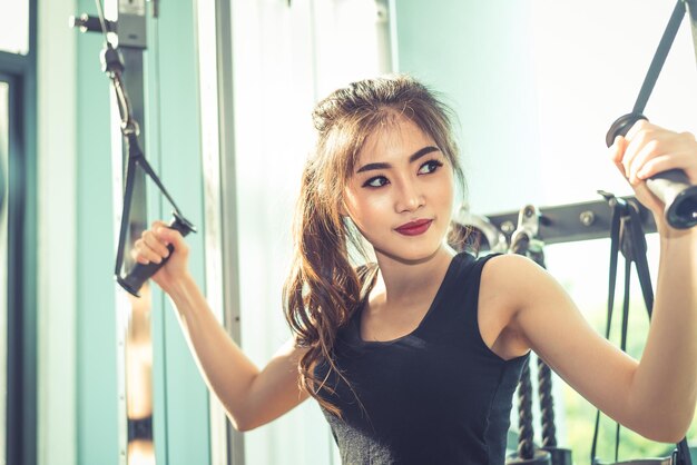 Young woman exercising in gym