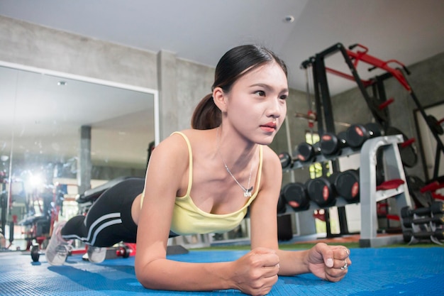 Young woman exercising at gym