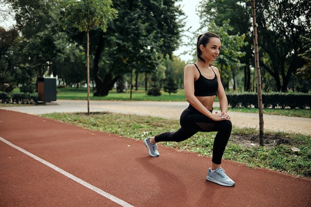 young woman exercising in the morning outdoors