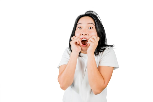 Young woman expressing shocked face in the studio