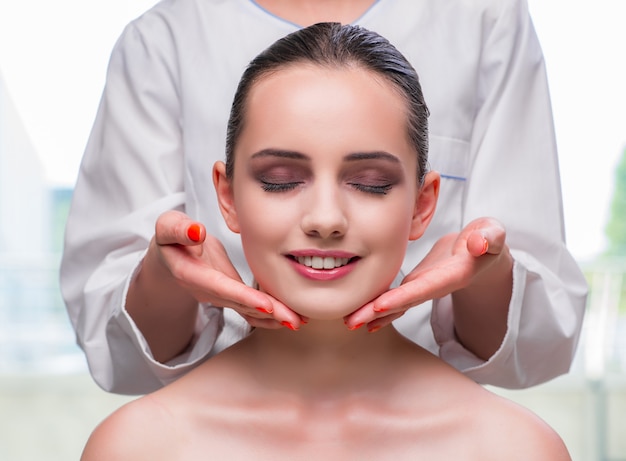 Young woman during face and skin massage session