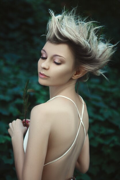 Young woman in a fairy dress in nature