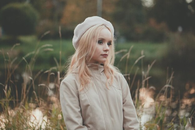 Young woman on fall nature background