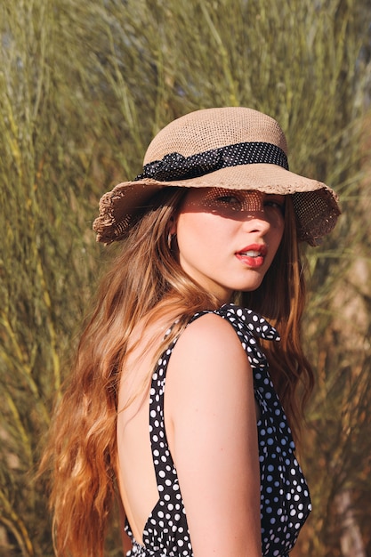 Young woman in fancy hat