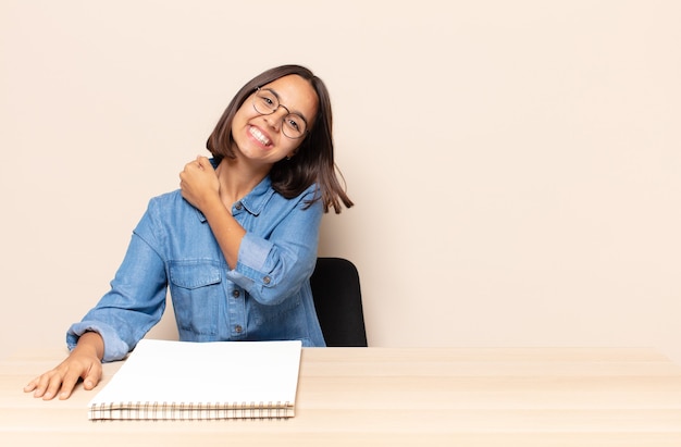 Young woman feeling happy, positive and successful, motivated when facing a challenge or celebrating good results