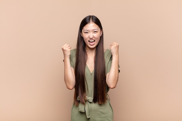 Young woman feeling happy