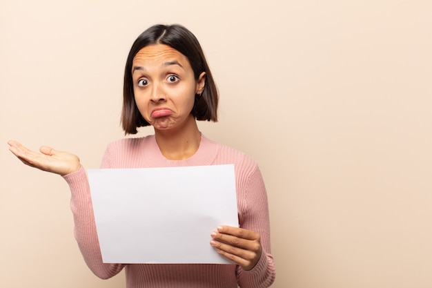 Young woman feeling puzzled and confused