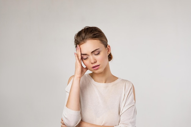 Young woman feeling stress and headache