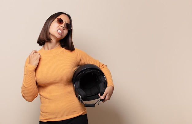 Young woman feeling stressed, anxious, tired and frustrated, pulling shirt neck