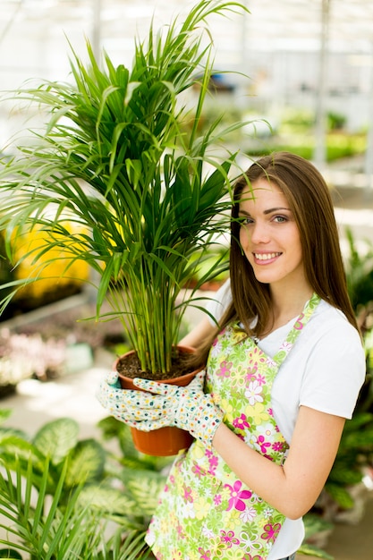 Young woman in flower garden